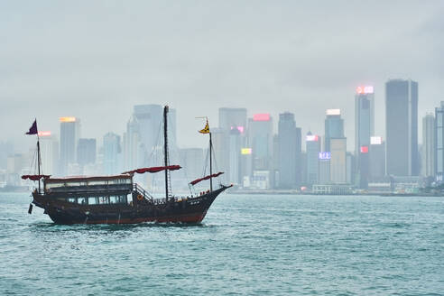 View to Victoria harbour with sailing ship in the foreground, Hong Kong, China - MRF02096