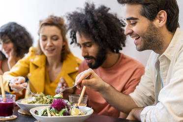 Friends having lunch in a restaurant - AFVF03507