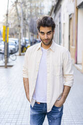 Portrait of a man standing on pavement - AFVF03542