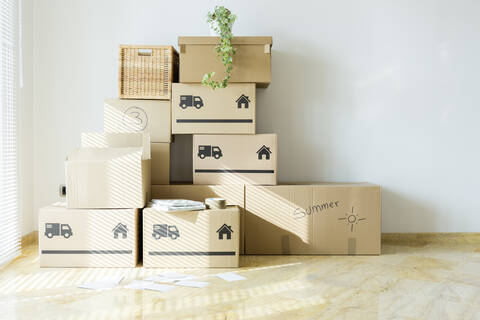 Cardboard boxes in new home stock photo