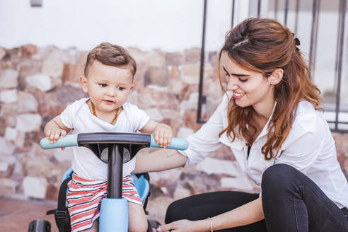 Mother with her son on tricycle - LJF00261