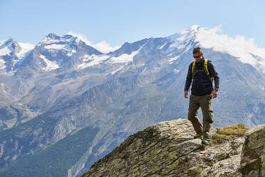 Hiker enjoying walk, Saas-Fee, Valais, Switzerland - CUF51763