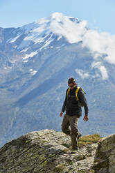 Hiker enjoying walk, Saas-Fee, Valais, Switzerland - CUF51764