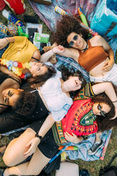 Group of friends relaxing at picnic in park - CUF51908