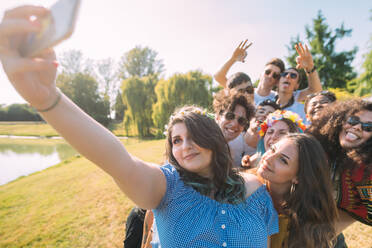 Group of friends taking selfie in park - CUF51924