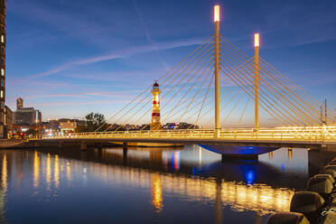 Illuminated bridge over river against sky at Malmo, Sweden - TAMF01674