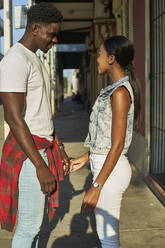 Flirting couple standing in the street in Mabuto, Mozambique - VEGF00348