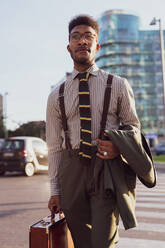 Businessman walking in city, Milano, Lombardia, Italy - CUF52161