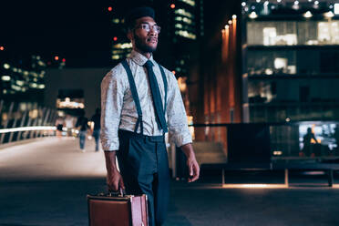 Businessman walking in city, Milano, Lombardia, Italy - CUF52245