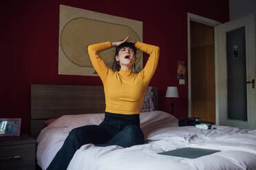 Stressed woman on bed - CUF52268