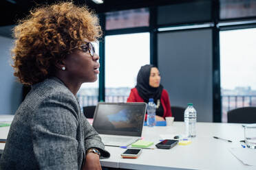 Business partners at brainstorming meeting in office - CUF52311