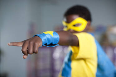 African American boy playing in superhero costume - BLEF07796