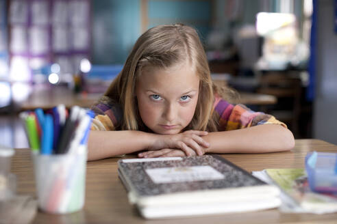 Bored Caucasian girl sitting in classroom - BLEF07799