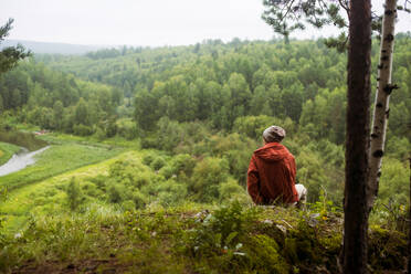 Caucasian man admiring scenic view from rural hilltop - BLEF08126
