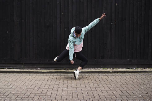 Young man dancing on the street - IGGF01199