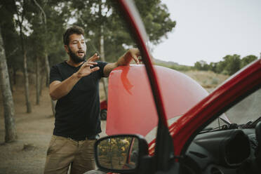 Couple on a road trip having a car breakdown - DMGF00067