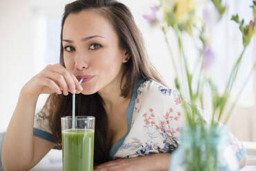 Woman drinking green juice - BLEF08705