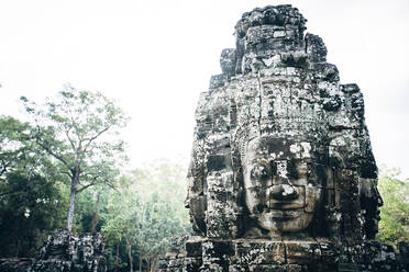 Dilapidated statue and pillar at Angkor Wat, Siem Reap, Cambodia - BLEF09053