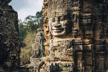 Dilapidated statue and pillar at Angkor Wat, Siem Reap, Cambodia - BLEF09054