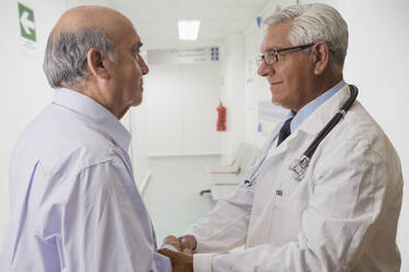 Hispanic doctor talking with patient - BLEF09141