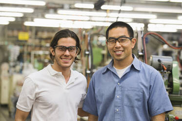 Workers smiling in textile factory - BLEF09180