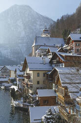 Scenic view of houses on lake shore - BLEF09402