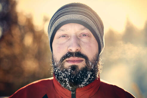 Caucasian man with snow in beard - BLEF09469