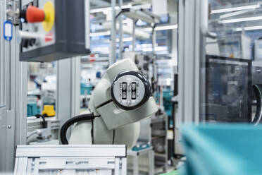 Arm of assembly robot functioning inside modern factory, Stuttgart, Germany - DIGF07177