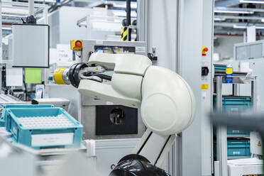 Arm of assembly robot functioning inside modern factory, Stuttgart, Germany - DIGF07178