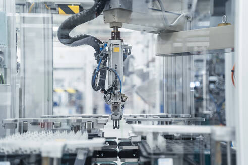 Arm of assembly robot functioning inside modern factory, Stuttgart, Germany - DIGF07183