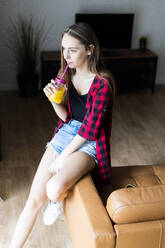 Young woman with a healthy drink at home - GIOF06684