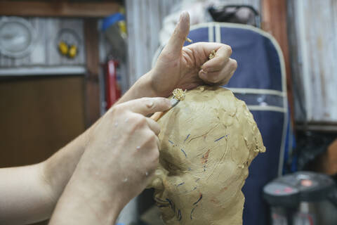 Sculptor working on a bust stock photo