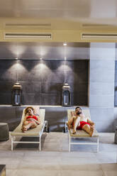Man and woman relaxing in a spa - LJF00387