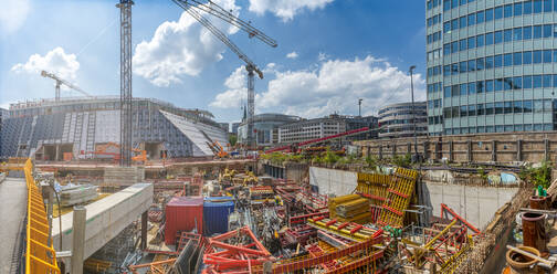 Modern buildings by construction site in city - FRF00860