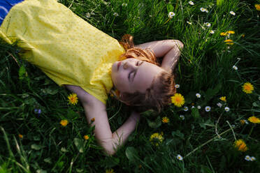 Girl relaxing on flower meadow - OGF00027
