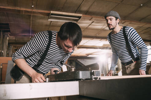 Carpenters at work on a saw - VPIF01316