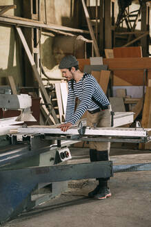 Carpenter working on a saw - VPIF01326