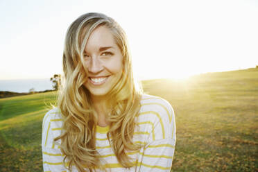 Caucasian woman smiling in field - BLEF09560