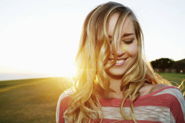 Caucasian woman smiling in field - BLEF09563