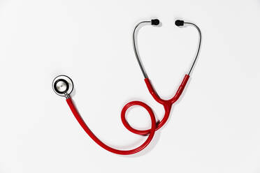 Red stethoscope on white background - FSIF04003