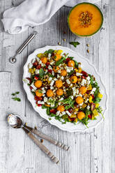 Directly above shot of healthy salad in plate on wooden table - SARF04339