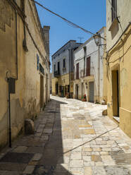 Empty alley amidst buildings in old town on sunny day - AMF07181