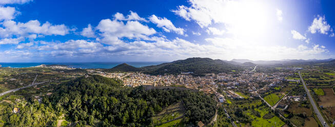 Aerial view of village by Mediterranean Sea against blue sky on sunny day - AMF07189