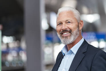 Portrait of a smiling mature businessman - DIGF07387