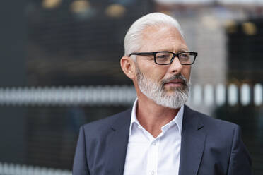 Portrait of mature businessman with glasses - DIGF07444
