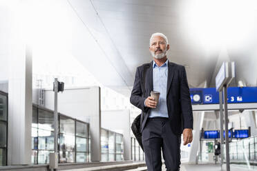 Mature businessman at the station platform - DIGF07454