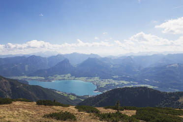 Scenic view of Wolfgangsee and Dachstein Mountains against blue sky - GWF06147