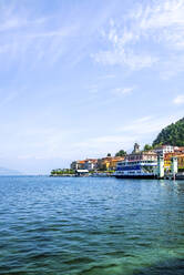 Ferry boat moored in Lake Como against blue sky - PUF01686