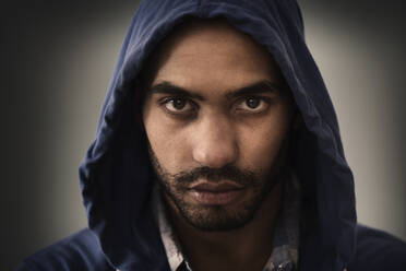 Serious Hispanic man wearing hoodie - BLEF10062