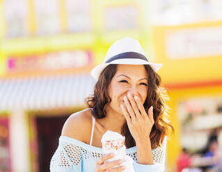 Chinese woman eating ice cream cone - BLEF10097